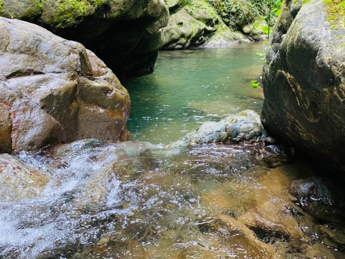 a large waterfall over a body of water